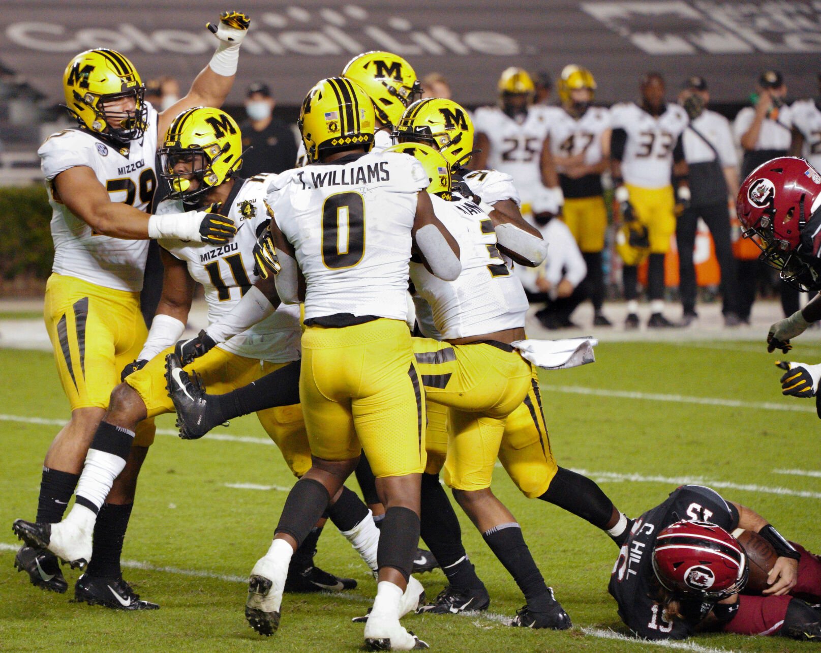 Linebackers celebrate a sack